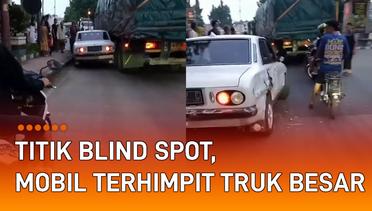Titik Blind Spot, Mobil Terhimpit Truk Besar di Jalan