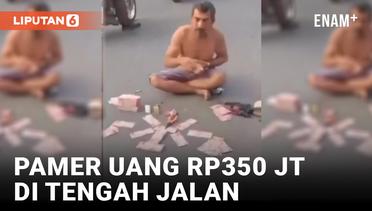 Viral! Pria di Tapanuli Tengah Pamer Uang Jutaan Rupiah di Tengah Jalan