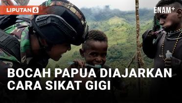 Prajurit TNI Ajarkan Bocah Papua Sikat Gigi yang Benar
