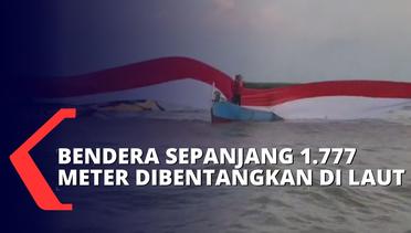 Nelayan dan Anggota Polres Pati Bentangkan Bendera Merah Putih Sepanjang 1.777 Meter di Laut Juwana