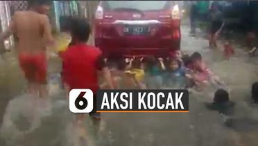 Aksi Kocak Bocah Diseret Mobil di Tengah Banjir