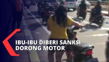 Sanksi Dorong Motor DIberikan ke Seorang Ibu Karena Tidak Pakai Helm saat Terjaring Razia