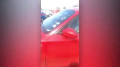 Jealous wife rams cheating husband's car