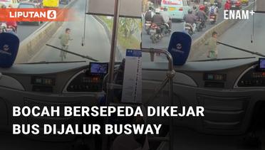 Momen Bocah Bersepeda Panik Buru-buru Dikejar Bus Pada Jalur Busway