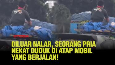 Momen Tak Biasa, Pria Nekat Duduk di Atap Mobil Saat Melaju di Jalan Tol!