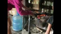 Cooking the snake, Laos 