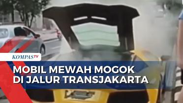 Diduga Mengalami Kenaikan Temperatur Mesin, Mobil Mewah Mogok di Jalur Transjakarta Jakarta Barat