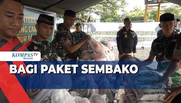 Personel TNI AD Bagi Sembako ke Warga Sekitar Markas Batalyon Zeni Tempur I Dhira Dharma