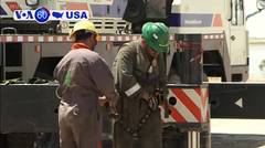 VOA60 America - Iraq says a decision by Exxon Mobil to evacuate its staff from Iraq is "unacceptable and unjustified