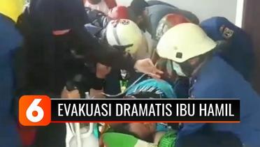 DRAMATIS! Begini Detik-Detik Evakuasi Ibu Hamil Menggunakan Tandu saat Diturunkan dari Lantai Dua Rumahnya