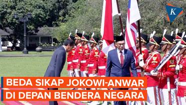 Beda Sikap Jokowi-Anwar di Depan Bendera