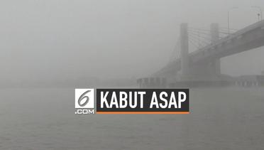 Sungai Musi Tertutup Kabut Asap Terparah di Palembang