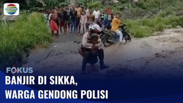 Warga Gendong Polisi Agar Bisa Melintasi Arus Banjir di Sikka | Fokus