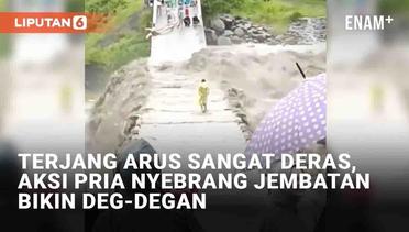 Terjang Arus Sangat Deras, Aksi Pria Nyebrang Jembatan Bikin Deg-Degan
