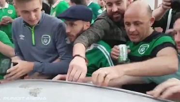 Ireland fans dent the roof of a French car, fix it straight away