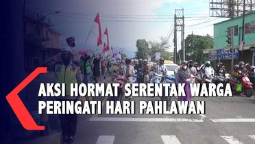 Aksi Hormat Serentak Warga di Tengah Jalan Peringati Hari Pahlawan