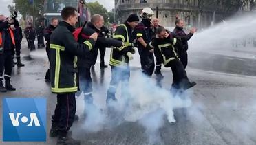 Police Fire Water Cannon at Protesting Firefighters in France