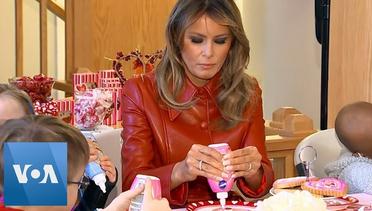 Melania Trump Makes Hearts With Children at Hospital