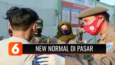Petugas TNI-Polri Terus Ingatkan Pedagang dan Pembeli Agar Terapkan Protokol Kesehatan New Normal