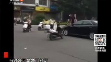 Hampir celaka, wanita menari di atas mobil di Tiongkok.