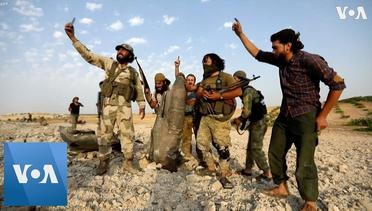 Rebel Fighters Gather Near Downed Syrian Regime Warplane